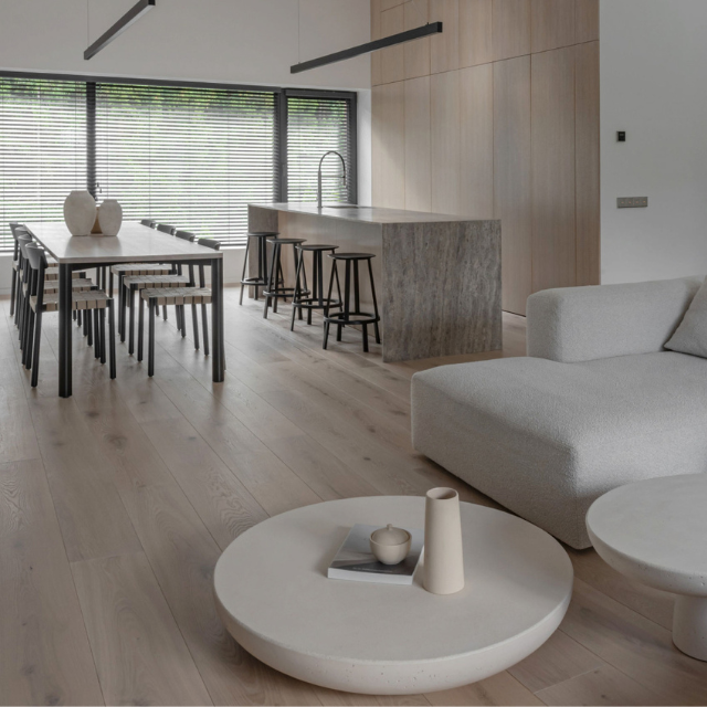 Open-plan kitchen and dining room with oak flooring